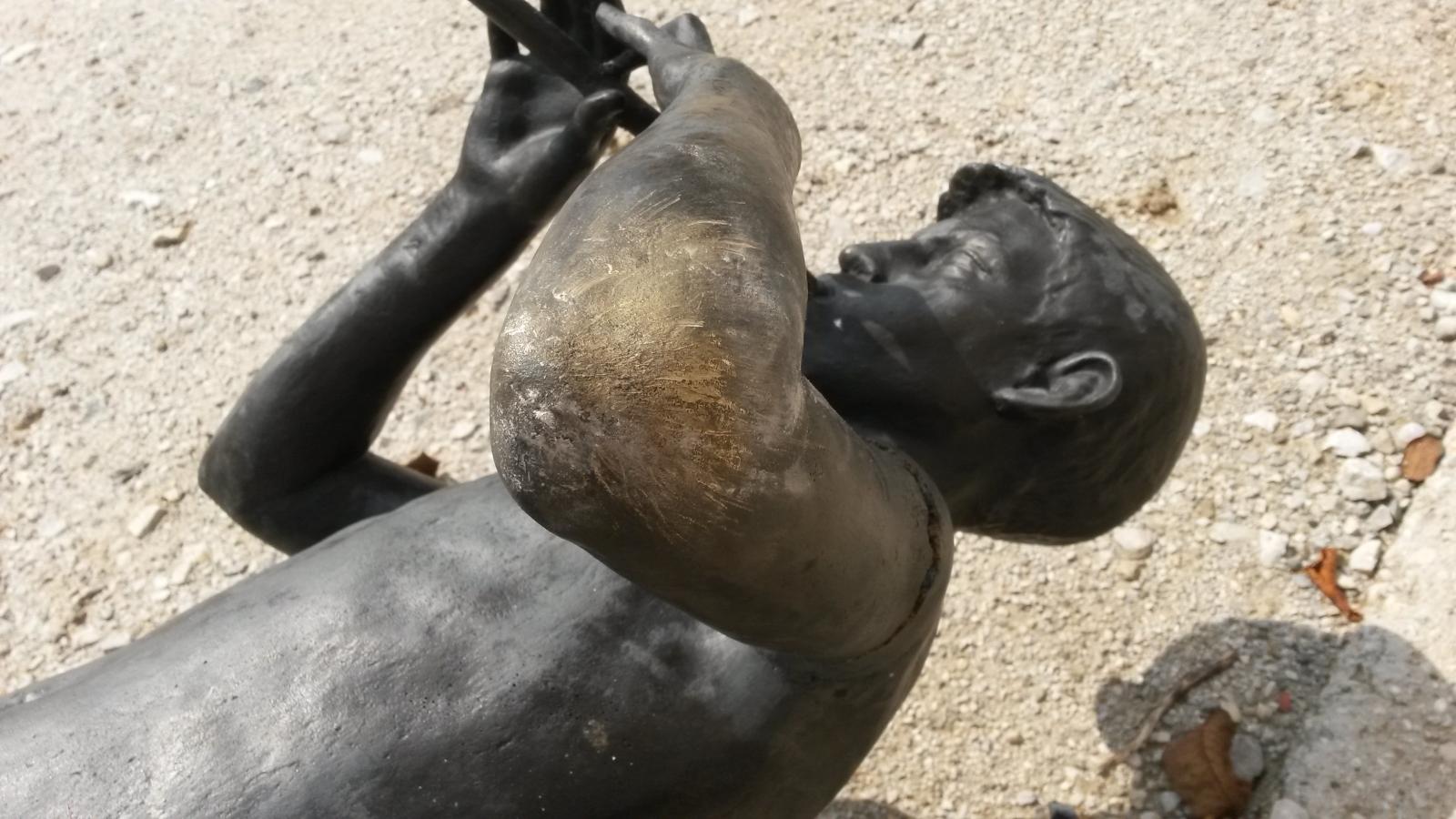 Broken bronze sculpture