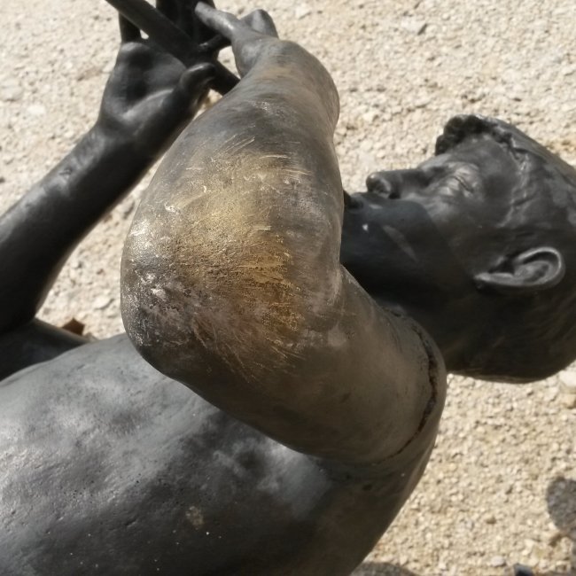 Broken bronze sculpture