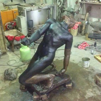 restoring a bronze statue