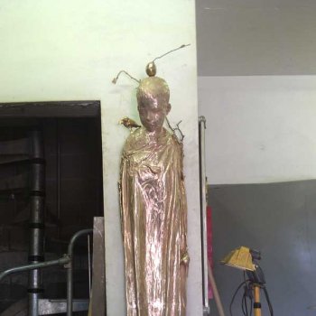 bronze sculpture of a boy
